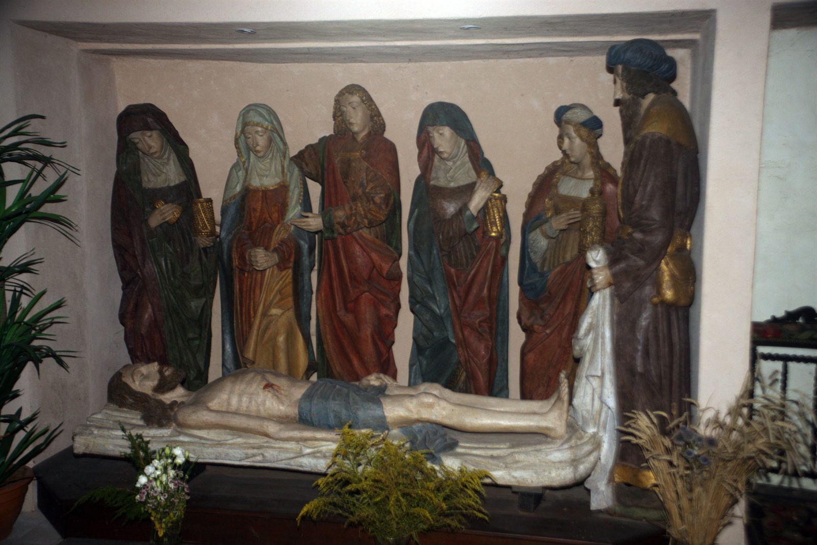 The polychrome wooden Entombment in the church of Saint-Michel: the recumbent Christ surrounded by six figures